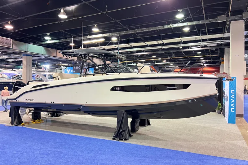 The Image of 2026 Navan S30 boat displayed at an indoor exhibition, showcasing sleek design and modern features. - 0