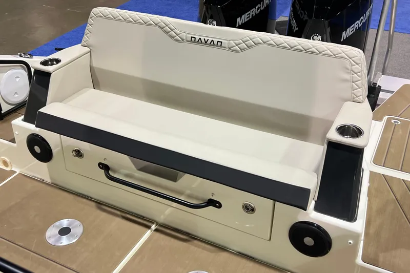 Slide: The Image of Navan S30 2026 boat seating area with cup holders and storage. - 15