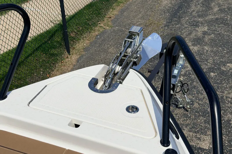 Slide: The Image of Bow of 2026 Navan S30 boat with anchor and railing, parked on pavement. - 21