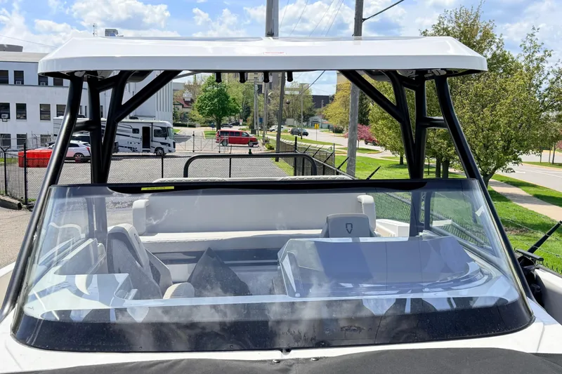 Slide: The Image of 2026 Navan S30 boat with sleek design, viewed from the front, parked outdoors. - 22