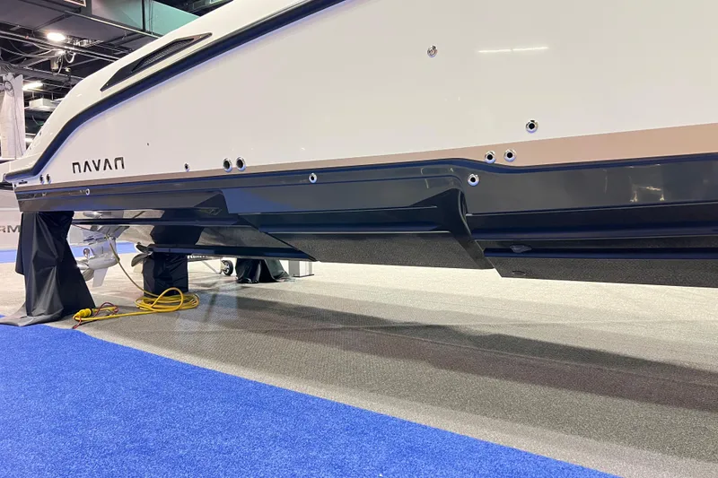 Slide: The Image of 2026 Navan S30 boat hull displayed at an indoor exhibition, showcasing sleek design. - 3