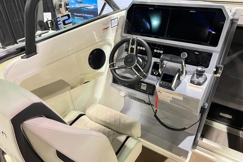 Slide: The Image of 2026 Navan S30 boat cockpit with modern steering, controls, and dual screens. - 8