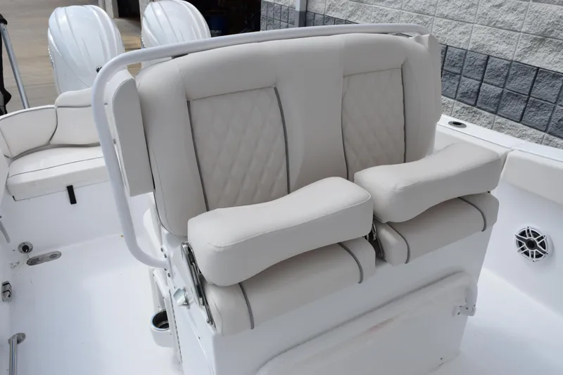 Slide: The Image of Luxurious seating on 2026 Sea Hunt Ultra 265 SE boat, featuring plush, white upholstery. - 10