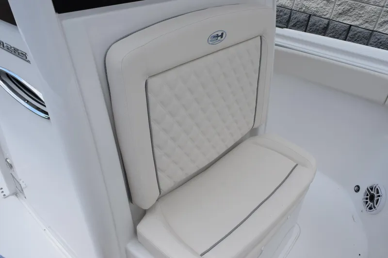 Slide: The Image of 2026 Sea Hunt Ultra 265 SE boat seat with quilted design and logo. - 13