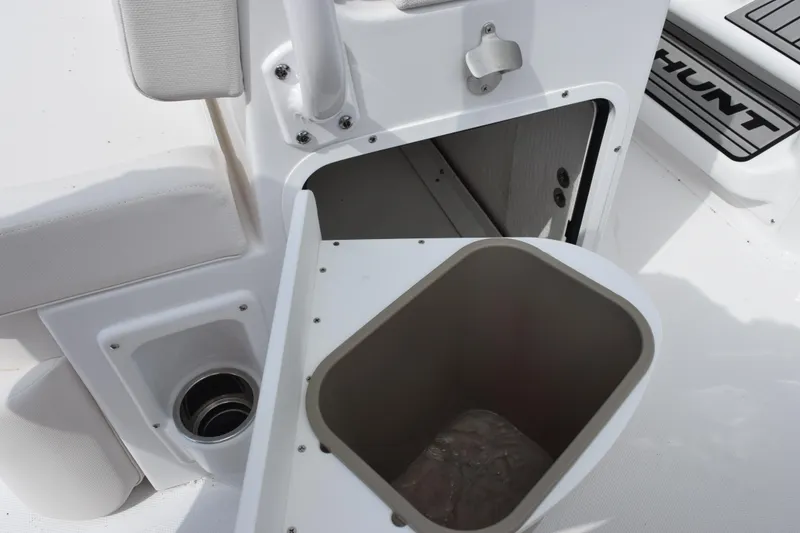Slide: The Image of Open storage compartment on 2026 Sea Hunt Ultra 265 SE boat interior. - 19