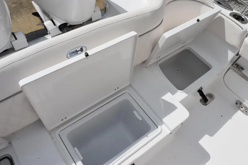 Slide: The Image of 2026 Sea Hunt Ultra 265 SE boat storage compartments, open and ready for use. - 21