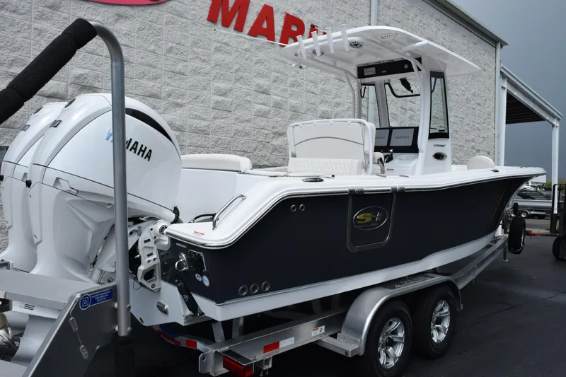 Slide: The Image of 2026 Sea Hunt Ultra 265 SE boat with Yamaha engines on a trailer. - 3