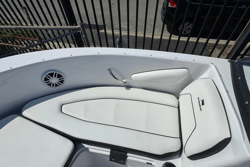 Slide: The Image of 2026 Stingray 172 SC boat interior with white cushioned seating and speaker. - 14