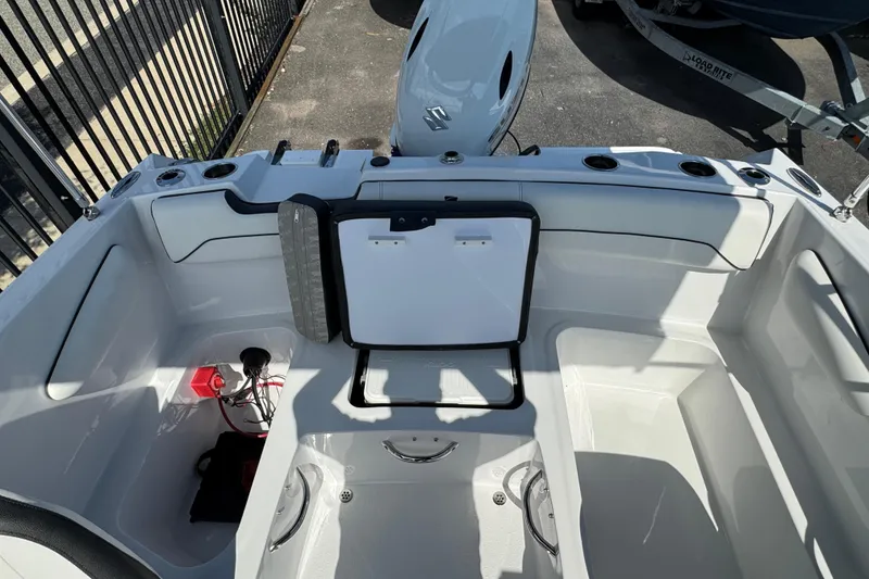 Slide: The Image of 2026 Stingray 172 SC boat interior with open storage compartment and seating. - 19