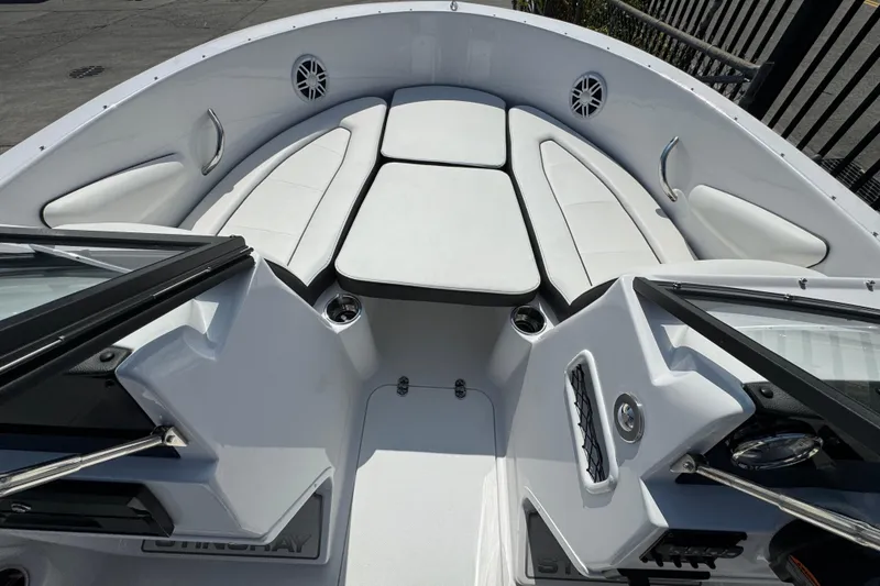 Slide: The Image of 2026 Stingray 172 SC boat interior with white seating and modern design. - 20