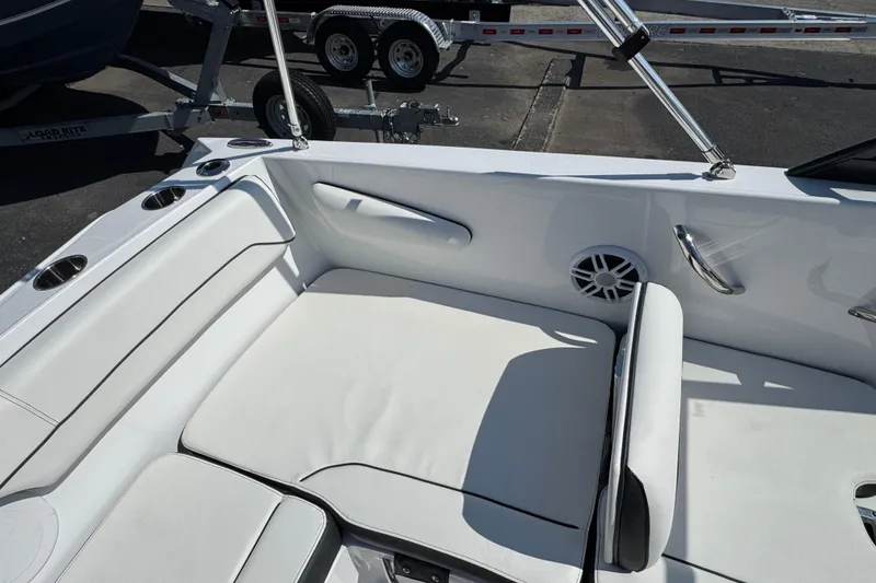 Slide: The Image of 2026 Stingray 172 SC boat interior with white seating and cup holders. - 7