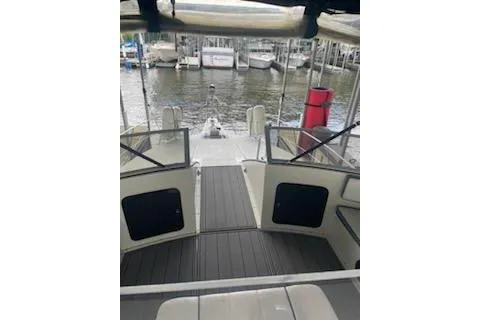 Slide: The Image of 1990 Carver 34-38 boat interior with open deck, docked at marina. - 20