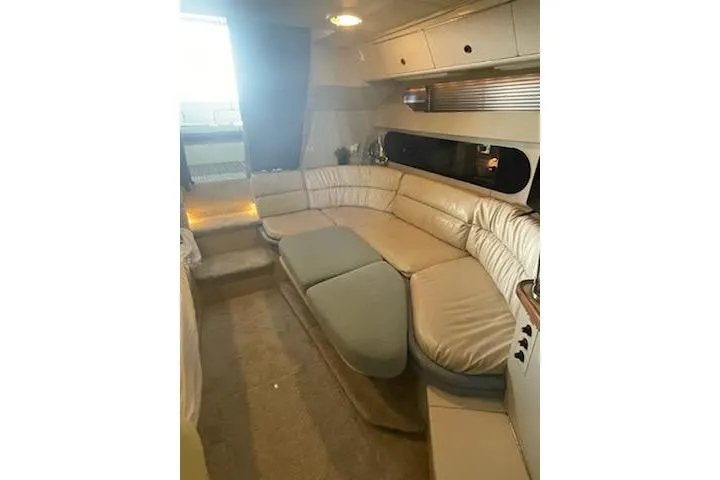 Slide: The Image of Luxurious interior of a 1990 Carver 34-38 yacht with plush seating. - 10