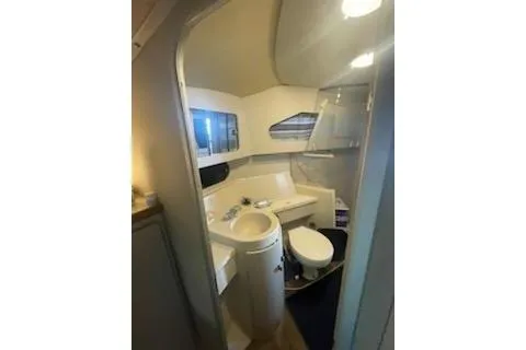 Slide: The Image of 1990 Carver 34-38 yacht bathroom with sink, toilet, and shower. - 12