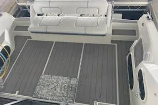 Slide: The Image of 1990 Carver 34-38 boat deck with seating and storage compartments. - 17
