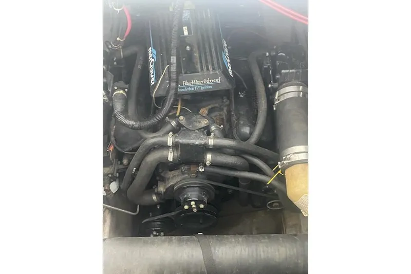 Slide: The Image of 1990 Carver 34-38 engine compartment with MerCruiser BlueWater inboard engine. - 21