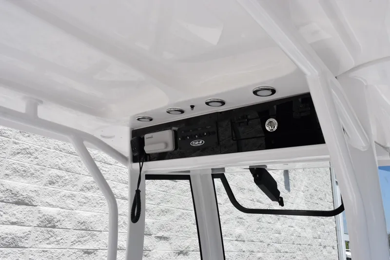 Slide: The Image of 2026 Sea Hunt Gamefish 27 Forward Seating boat console with modern controls and sleek design. - 10
