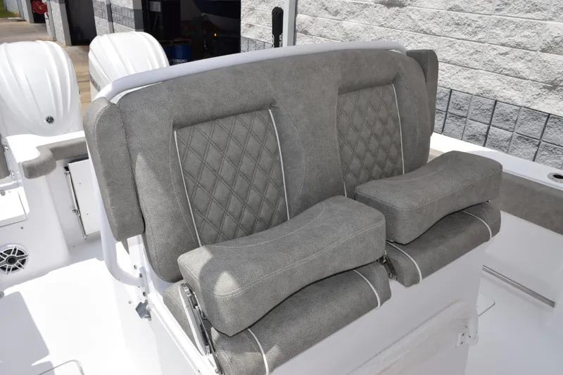 Slide: The Image of 2026 Sea Hunt Gamefish 27 Forward Seating with plush, gray, diamond-stitched upholstery. - 11