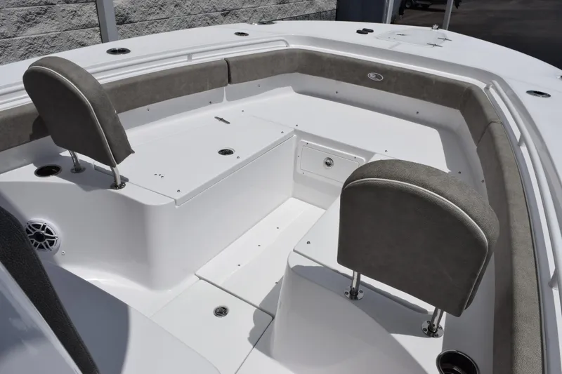 Slide: The Image of 2026 Sea Hunt Gamefish 27 Forward Seating interior with cushioned seats and storage. - 12