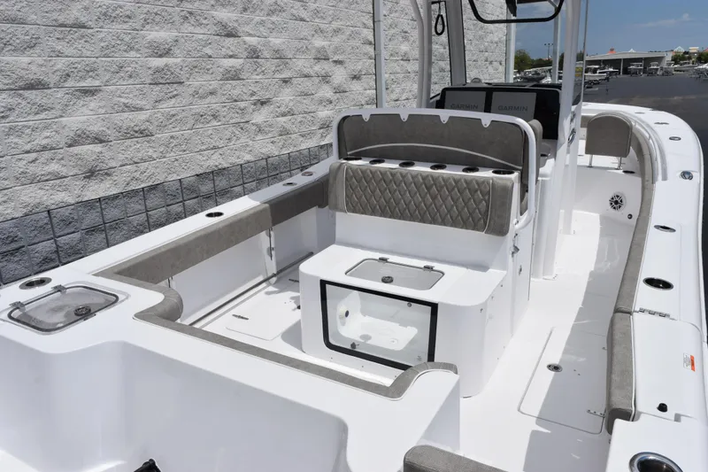 Slide: The Image of 2026 Sea Hunt Gamefish 27 Forward Seating boat interior with cushioned seating and storage. - 7