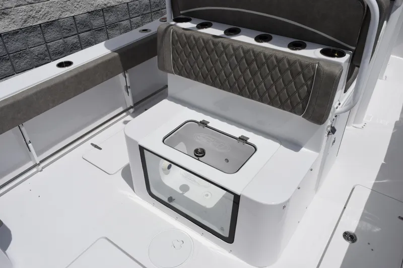 Slide: The Image of 2026 Sea Hunt Gamefish 27 Forward Seating boat interior with cushioned seating and storage. - 8