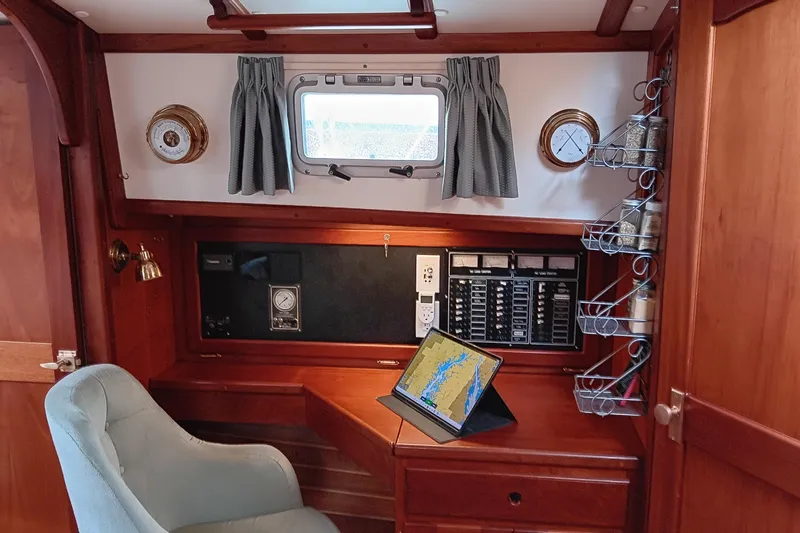 Slide: The Image of Cozy 1991 Gozzard 31 yacht interior with navigation station and tablet. - 21