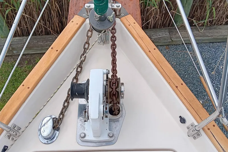 Slide: The Image of Bow of 1991 Gozzard 31 sailboat with anchor chain and windlass. - 9