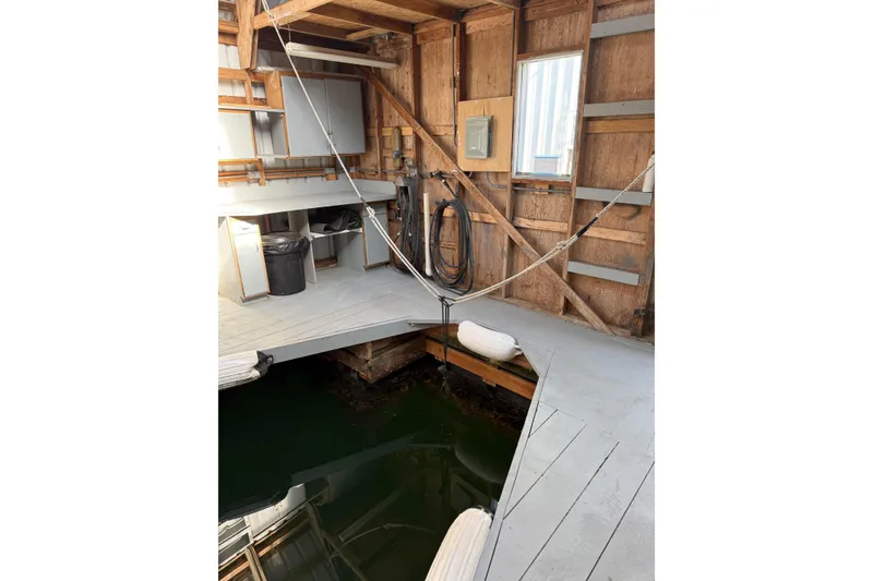 Slide: The Image of Interior of a 2006 BoatHouse, 18' x 40', with dock and storage area. - 4