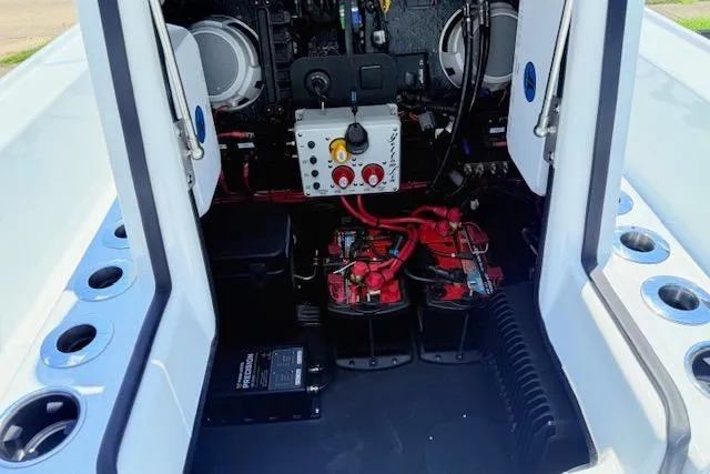 Slide: The Image of 2026 Yellowfin 24 Bay CE boat interior with cup holders and speakers. - 12