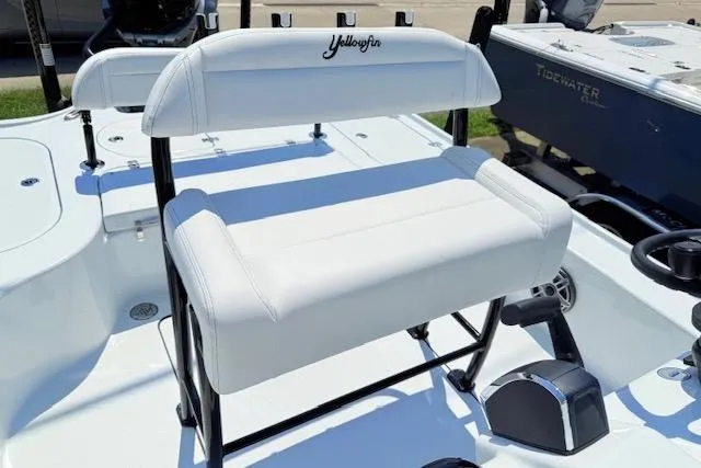Slide: The Image of 2026 Yellowfin 24 Bay CE boat with white seating and sleek design. - 13