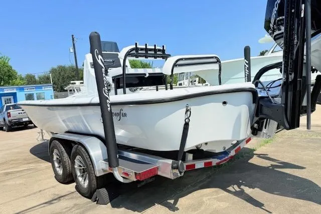 Slide: The Image of 2026 Yellowfin 24 Bay CE boat dashboard with Garmin and Mercury controls. - 4