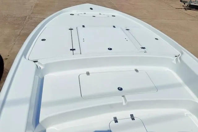 Slide: The Image of Open storage compartment on 2026 Yellowfin 24 Bay CE boat, showcasing interior space. - 7