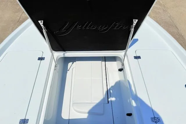 Slide: The Image of 2026 Yellowfin 24 Bay CE boat interior with white seating and built-in speakers. - 8