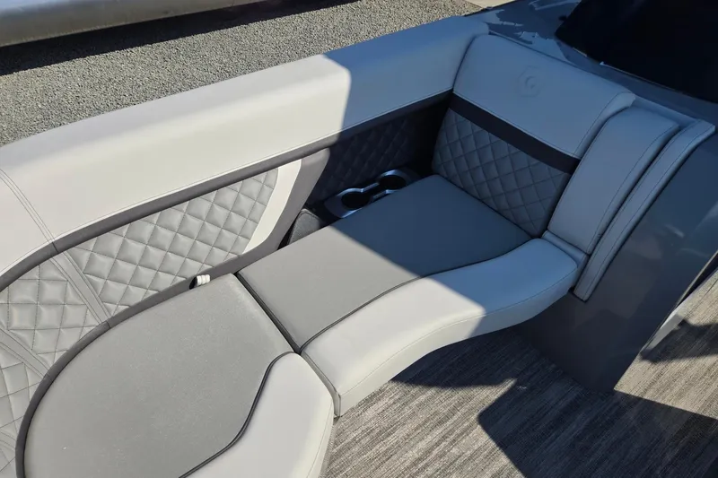 Slide: The Image of Luxurious seating on 2026 Godfrey AquaPatio 255 SFL pontoon boat, featuring quilted upholstery. - 10