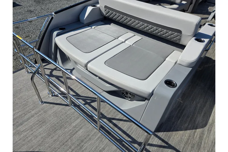 Slide: The Image of 2026 Godfrey AquaPatio 255 SFL boat seating area with sleek design and cup holders. - 27