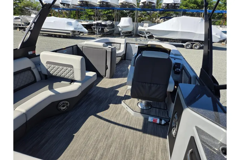 Slide: The Image of 2026 Godfrey AquaPatio 255 SFL boat interior with luxurious seating and modern design. - 29