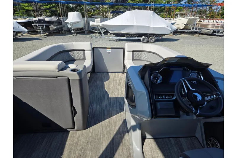 Slide: The Image of 2026 Godfrey AquaPatio 255 SFL interior with modern helm and spacious seating. - 31