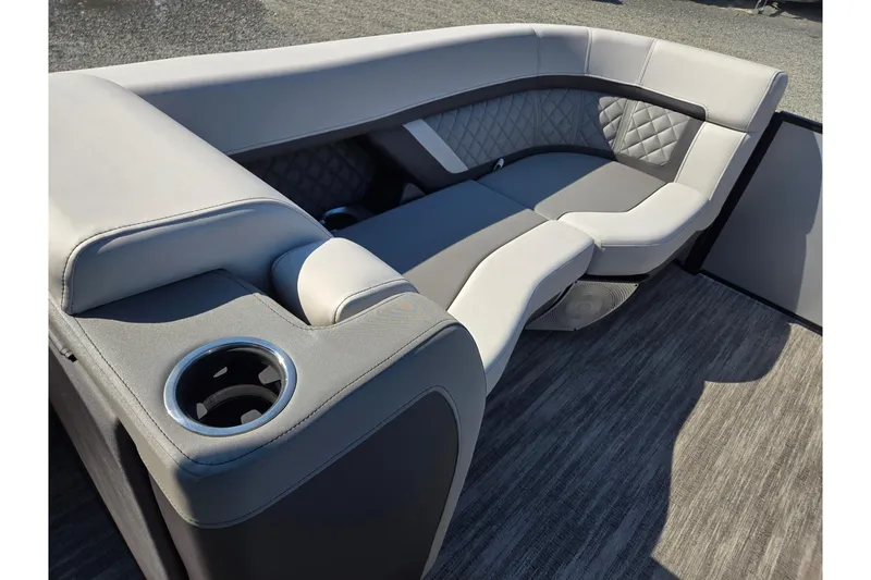 Slide: The Image of Luxurious seating on 2026 Godfrey AquaPatio 255 SFL pontoon boat with cup holder. - 35