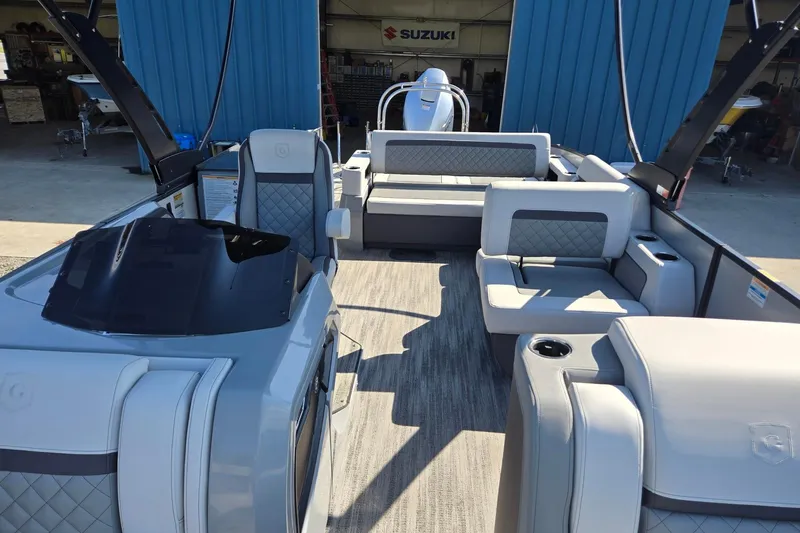 Slide: The Image of 2026 Godfrey AquaPatio 255 SFL pontoon boat interior with luxurious seating and modern design. - 9