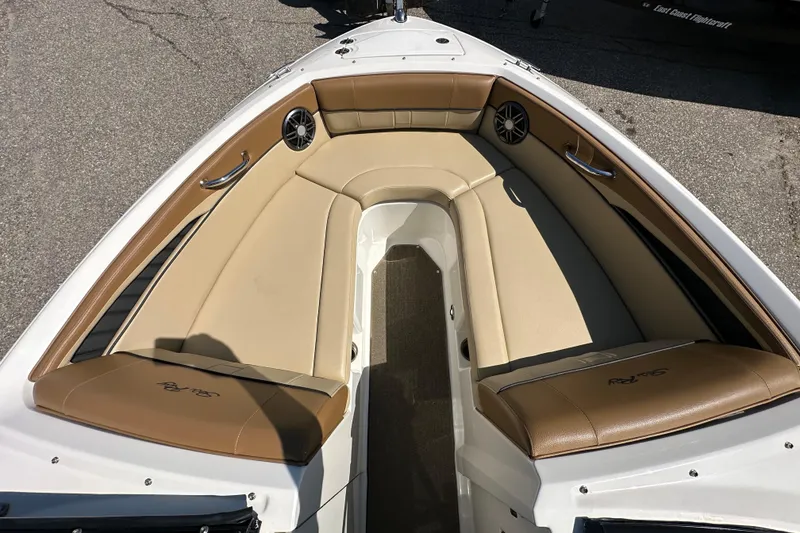 Slide: The Image of Bow seating area of a 2015 Sea Ray 230 SLX boat with tan upholstery. - 16