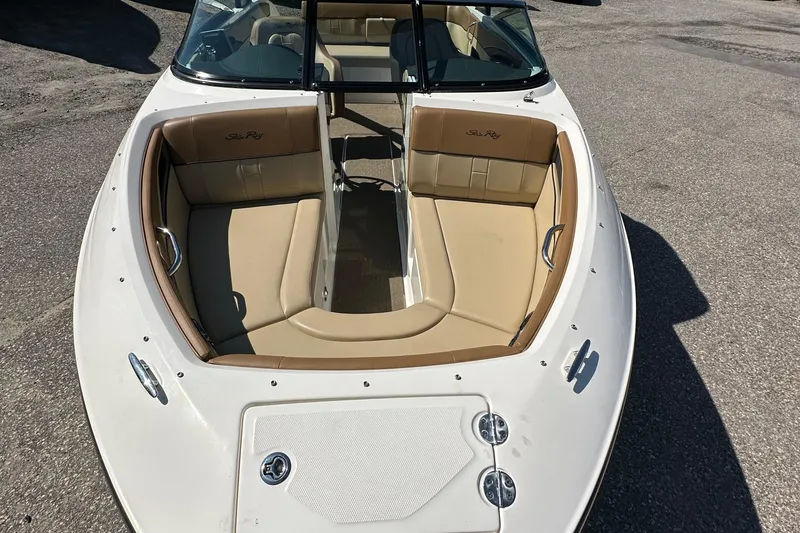Slide: The Image of 2015 Sea Ray 230 SLX boat with tan seating and sleek design. - 5