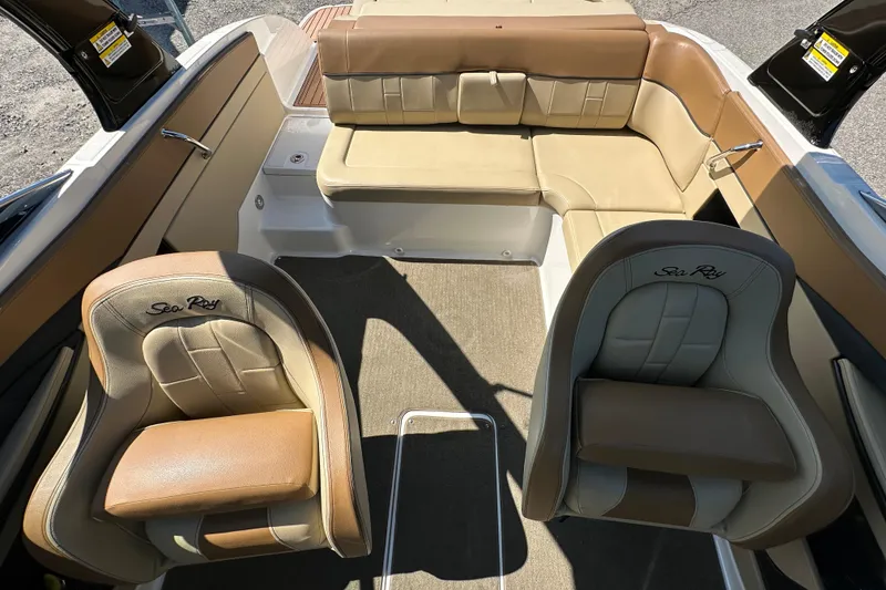 Slide: The Image of 2015 Sea Ray 230 SLX boat interior with tan leather seating and carpeted floor. - 8