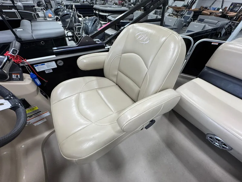Slide: The Image of Captain's chair on 2018 Manitou 21 Aurora LE Standard boat, beige upholstery. - 13