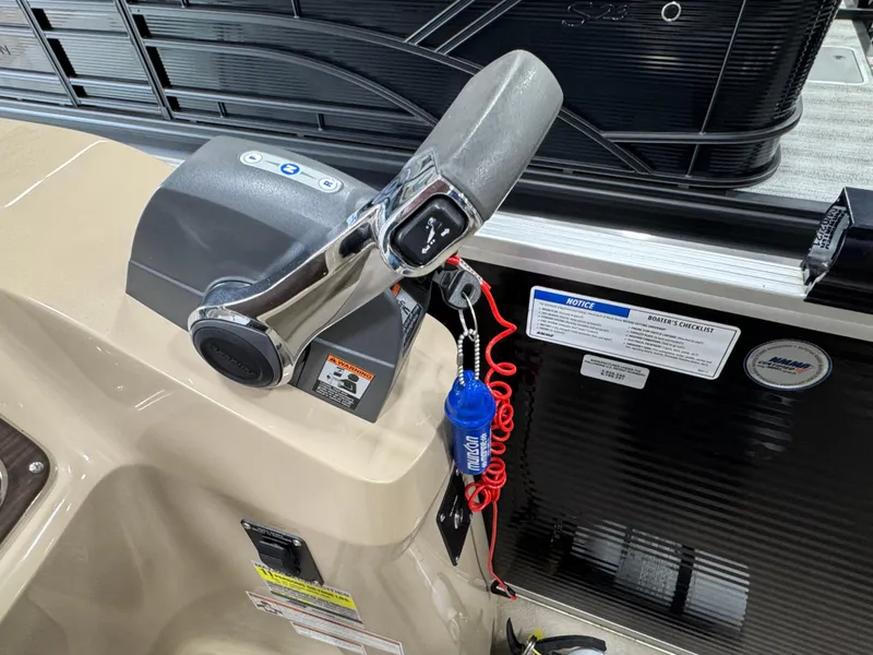Slide: The Image of Control panel of 2018 Manitou 21 Aurora LE Standard boat with throttle and safety lanyard. - 16