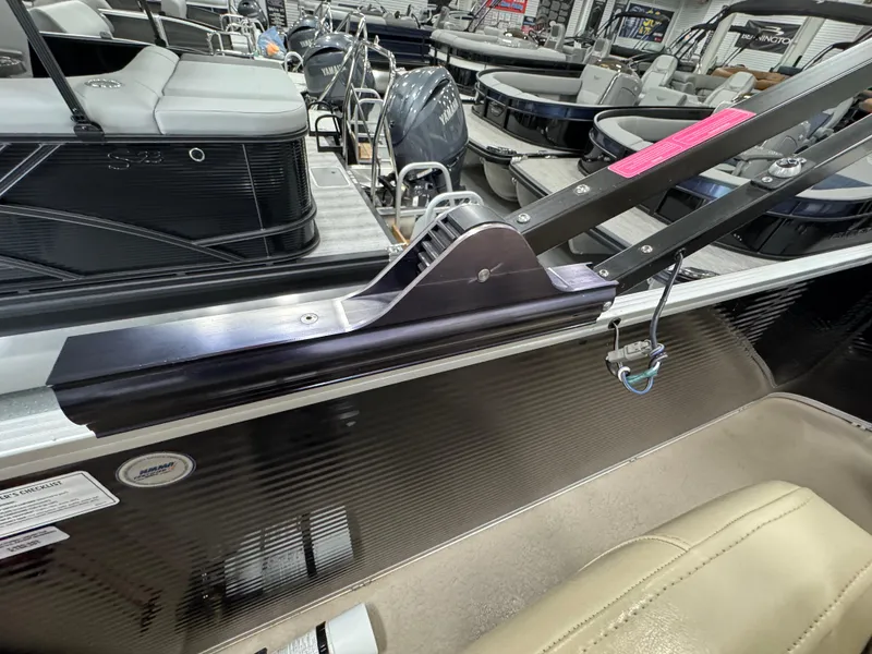 Slide: The Image of 2018 Manitou 21 Aurora LE Standard boat interior with seating and railing details. - 22