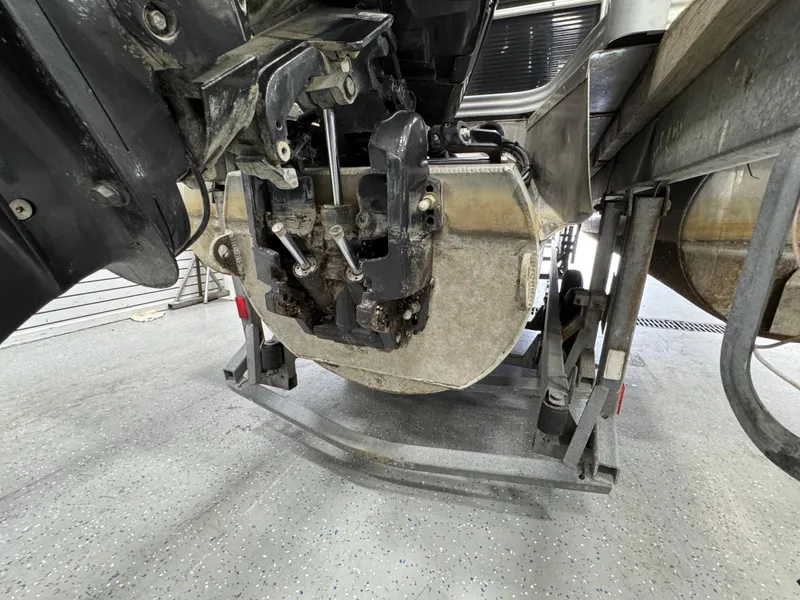 Slide: The Image of 2018 Manitou 21 Aurora LE Standard boat engine on maintenance stand. - 6