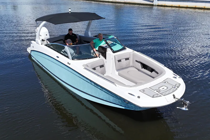 Slide: The Image of 2022 Four Winns HD8 boat with canopy cruising on calm water. - 1