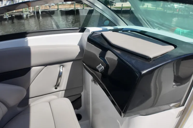 Slide: The Image of 2022 Four Winns HD8 boat interior with sleek seating and modern design. - 14