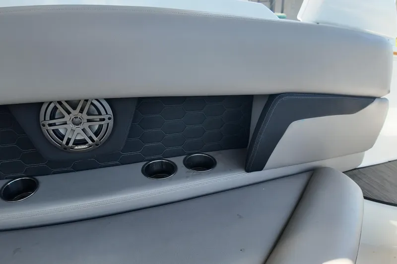 Slide: The Image of 2022 Four Winns HD8 boat interior with speaker, cup holders, and stylish upholstery. - 21