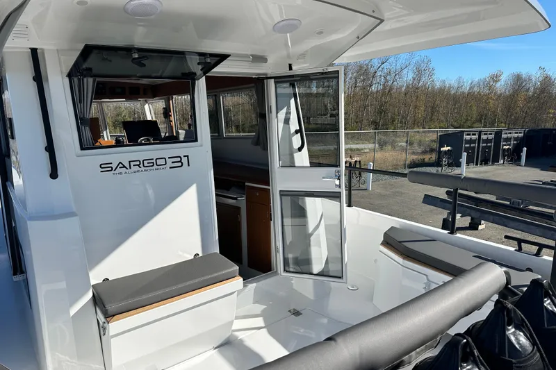 Slide: The Image of 2025 Sargo 31OB boat on display with Yamaha outboard motor. - 0